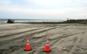 Dozers moving sand into piles on Avalon beachfront